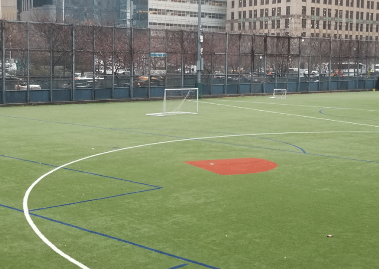 ballfields with green grass and sports markers at battery park ballfields