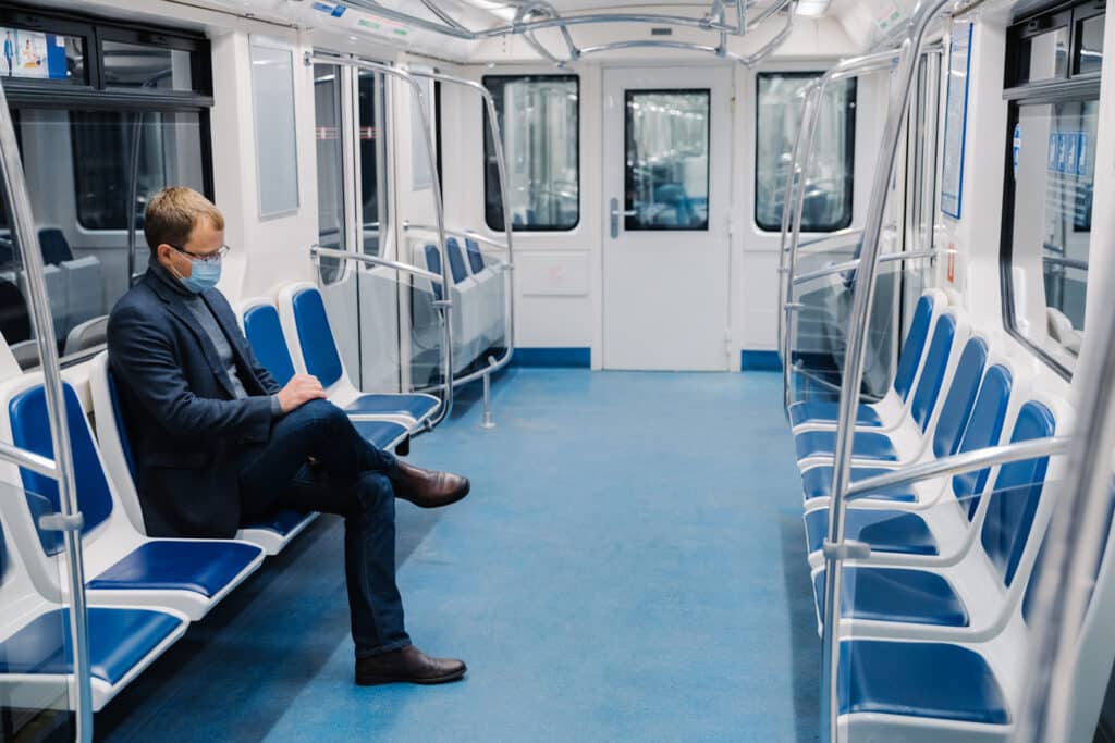 A passenger on an empty train car