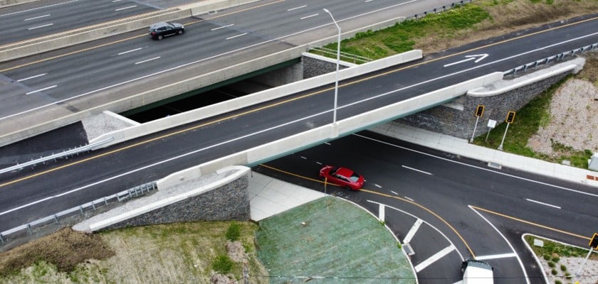 overlapping roads with cars on them